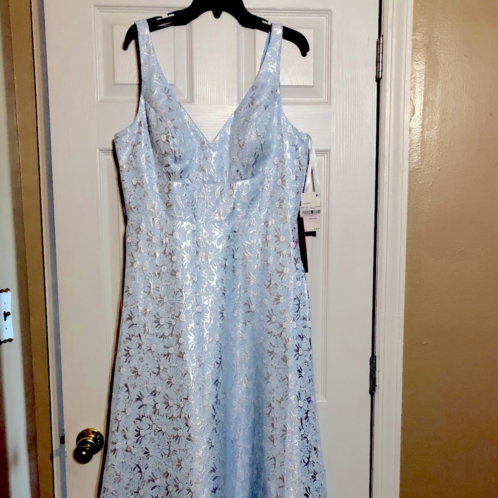 Formal dress NEW w/tag. Size 15/16 but fits more like a size 14